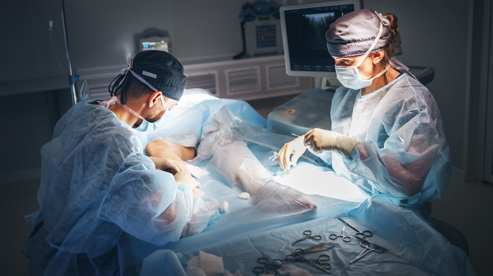 doctor and an assistant in operating room for surgical clinic